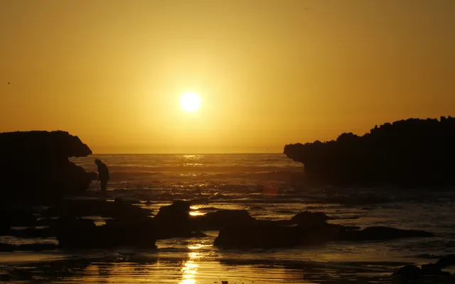 Sunset over the Taghazout coast — the Taghazout Bay zone where the Riu Palace Tikida sits is 5 km south of the historic village